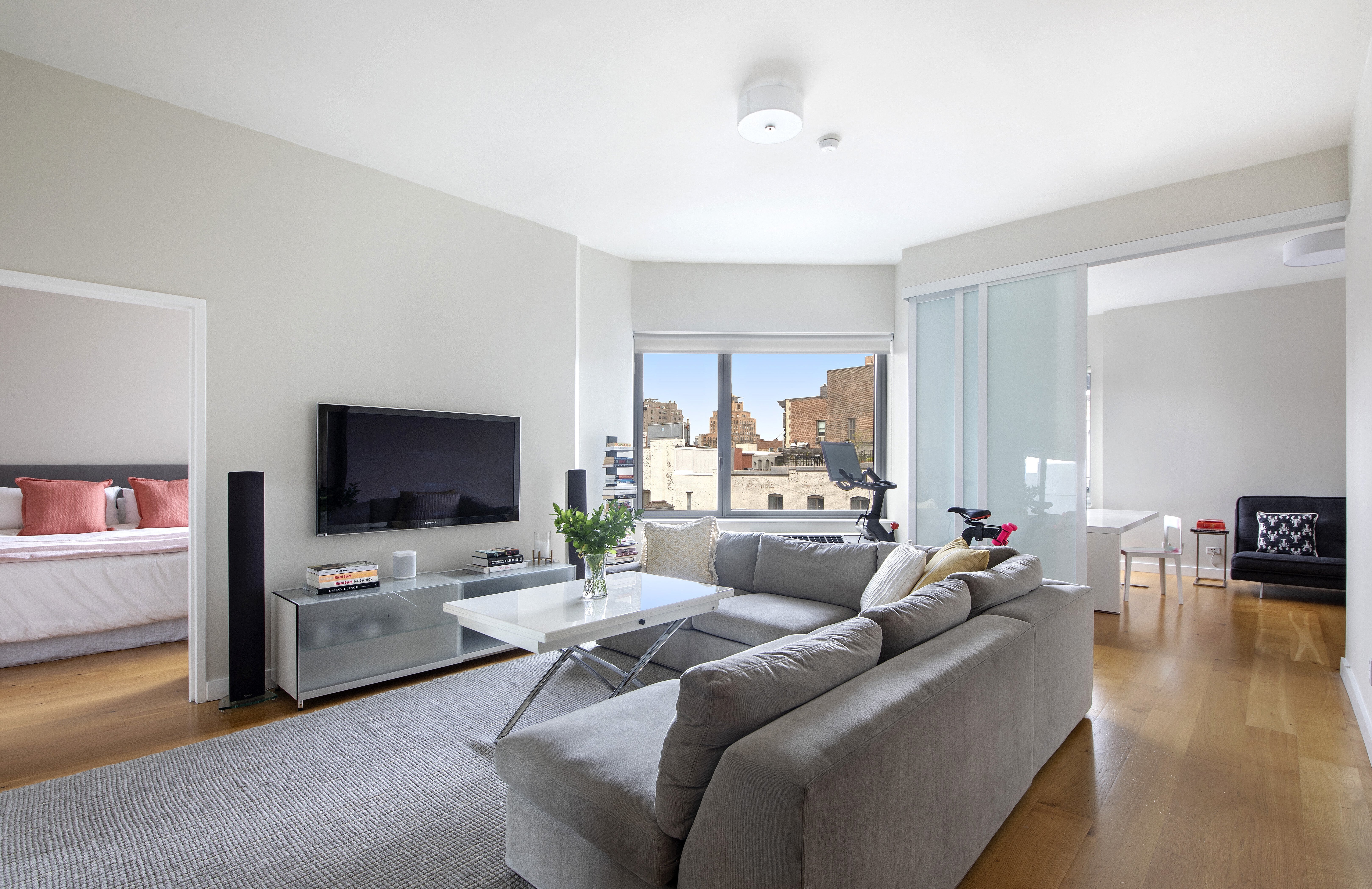 a living room with furniture and a flat screen tv