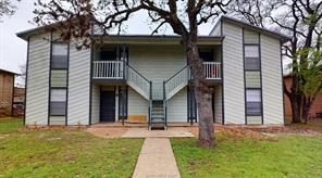 View of front of home with a patio and a front law