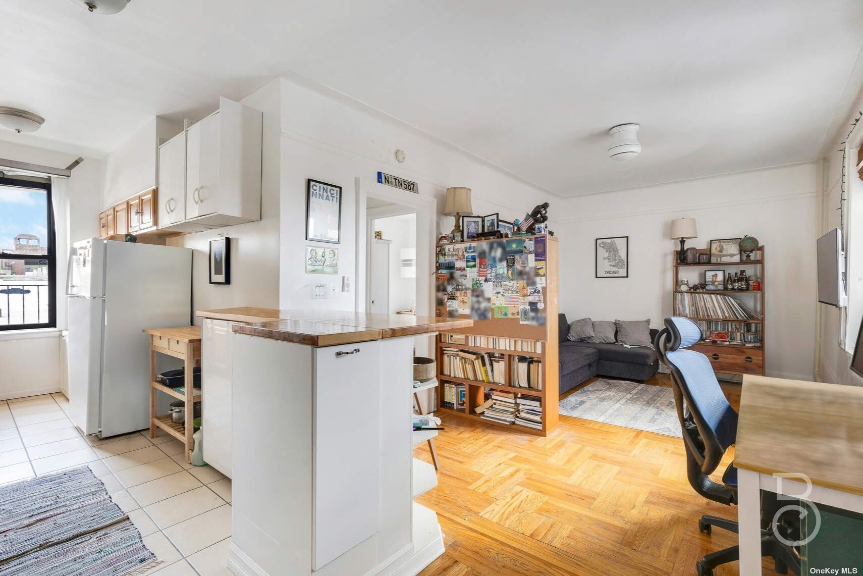 a kitchen with stainless steel appliances kitchen island granite countertop a table and chairs in it