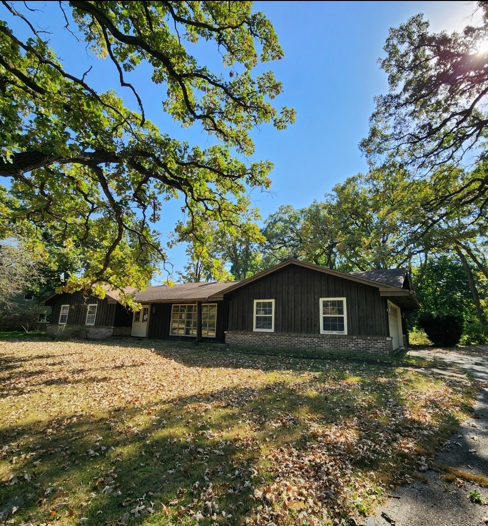 a view of a house with a tree