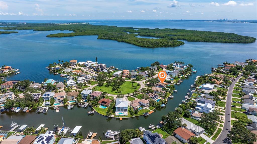 an aerial view of a house with a lake view