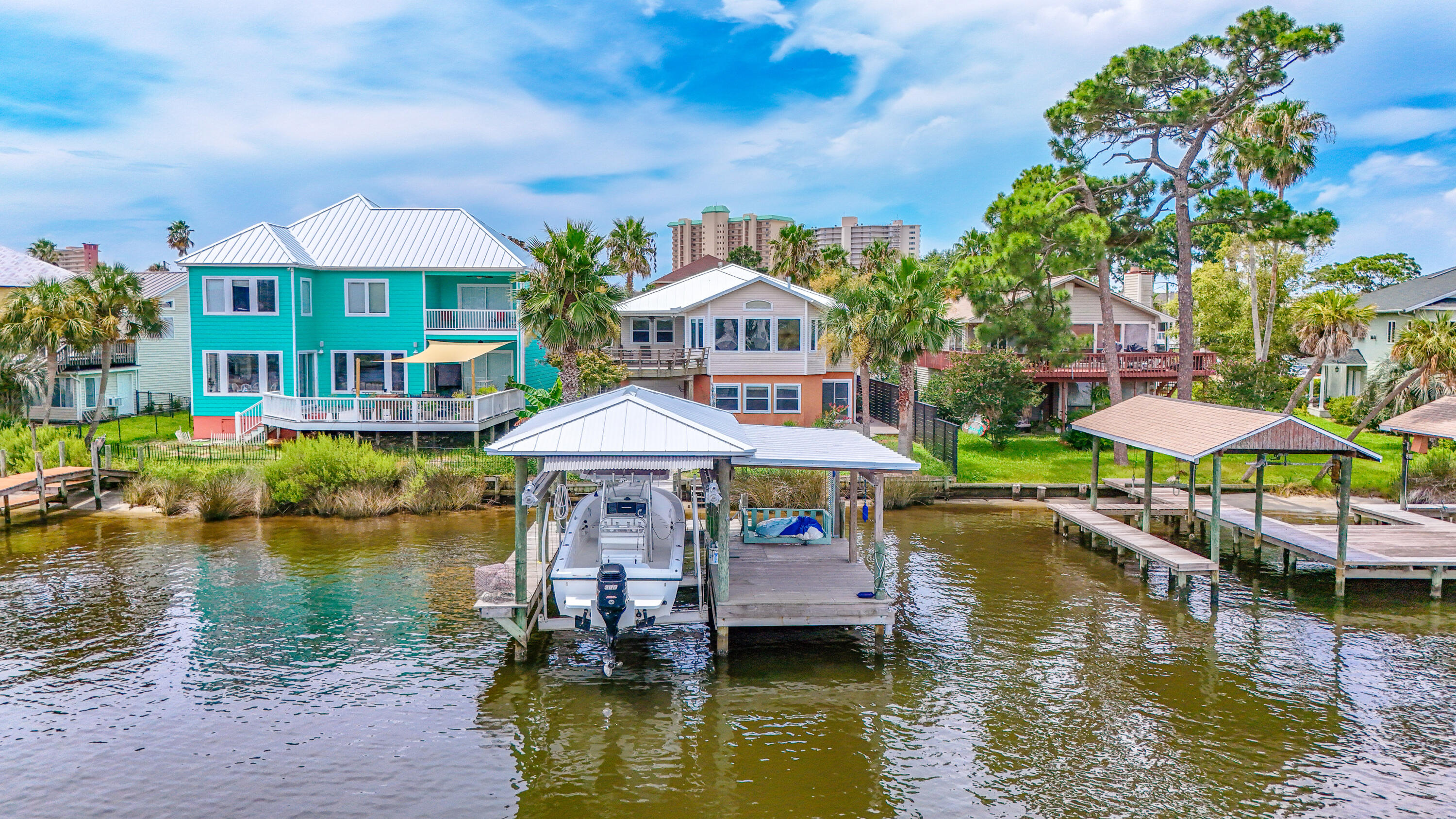 a front view of a house with a lake view and a chair