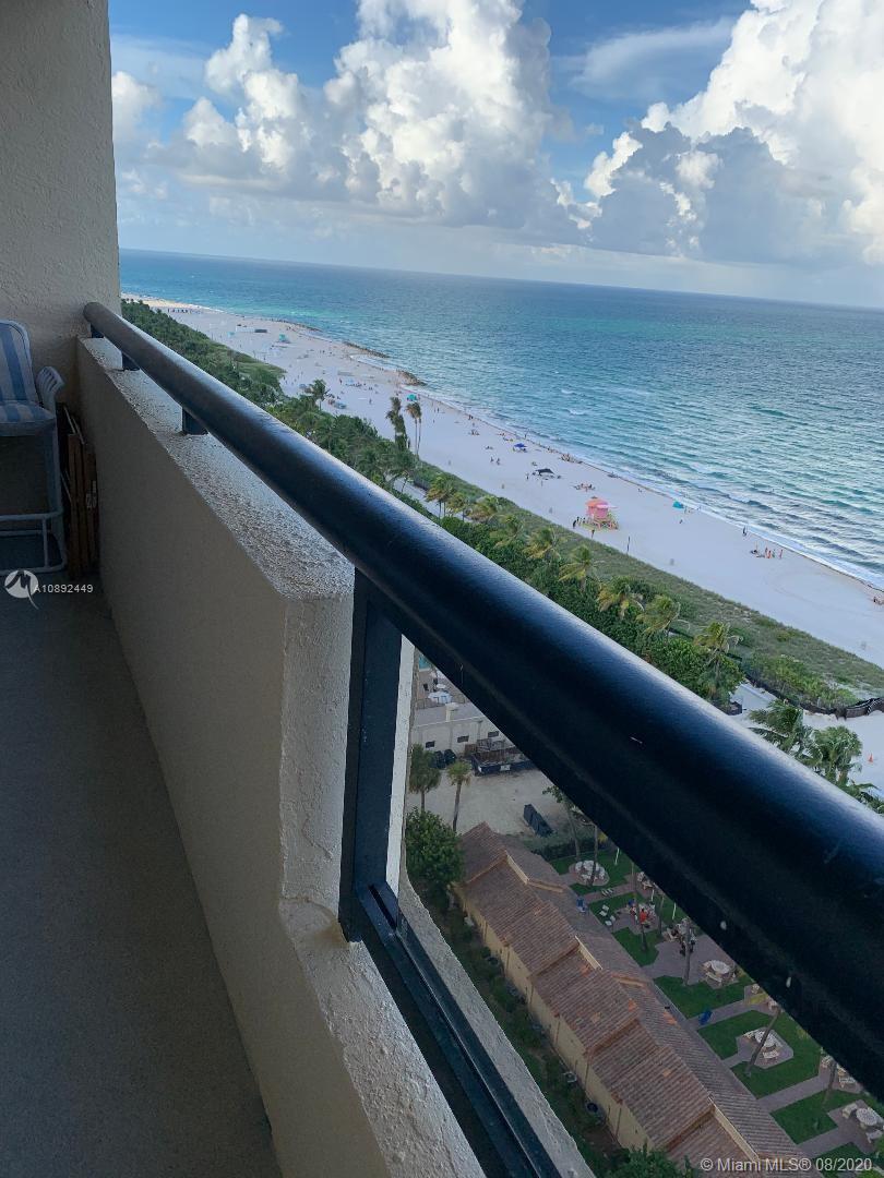 a view of a yard from a balcony