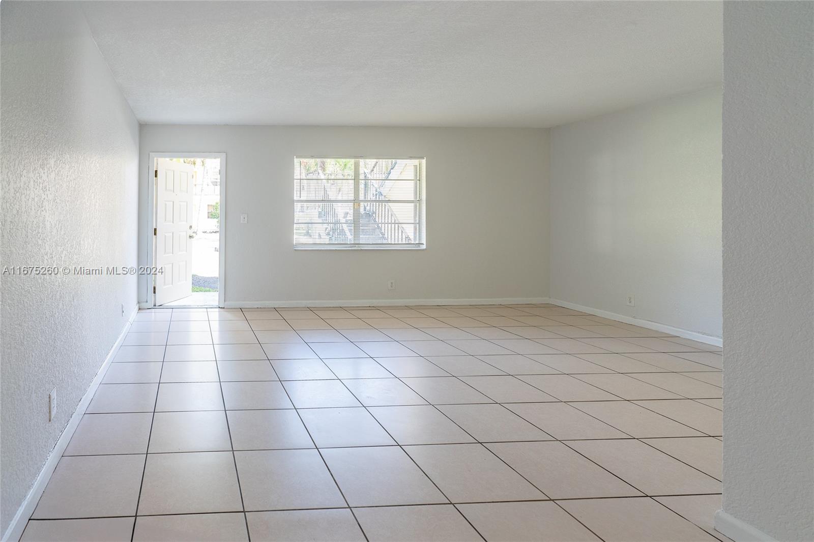 a view of an empty room and window