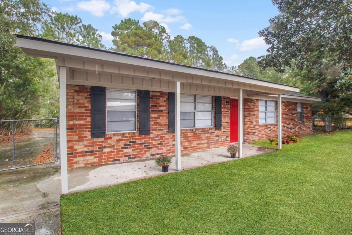 front view of a house with a yard