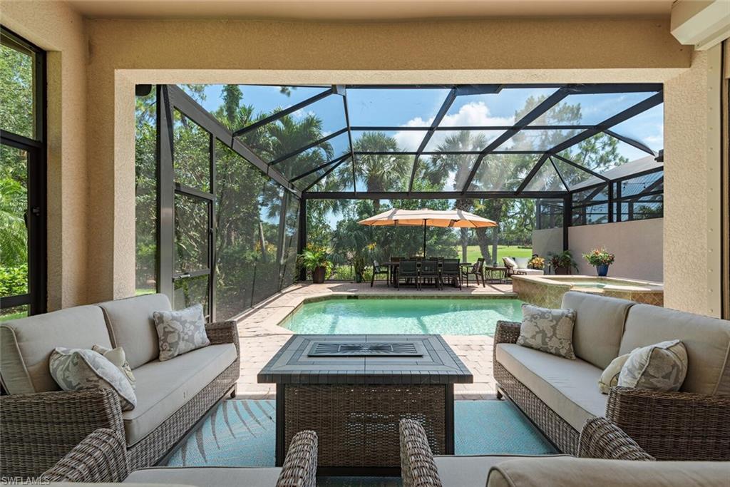 a living room with furniture a garden and a table