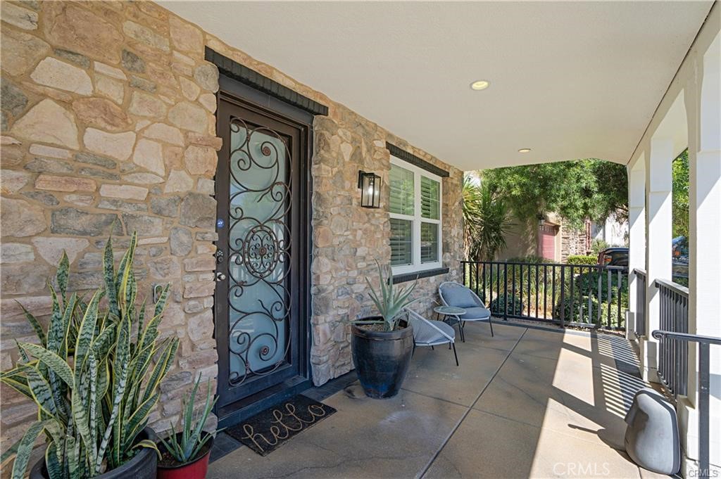 a view of a porch with a furniture