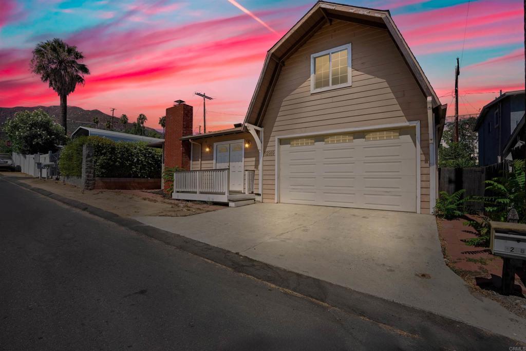 a view of a house with a street