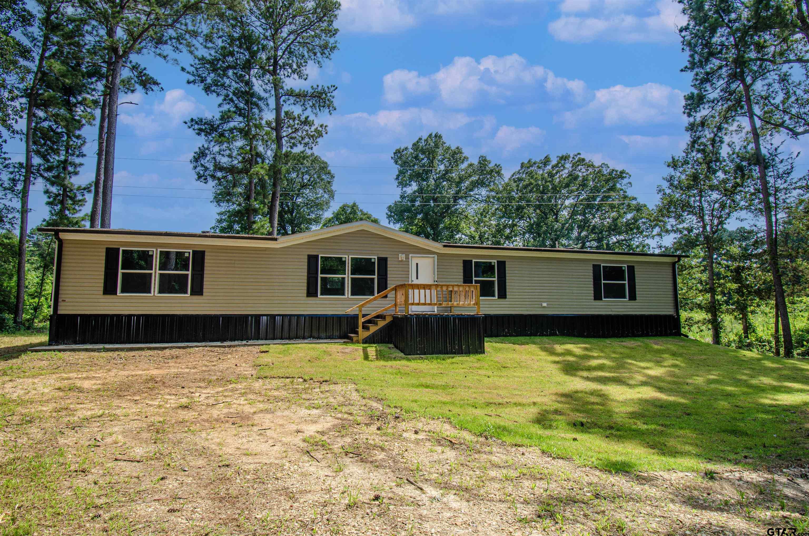 a view of a back yard of the house