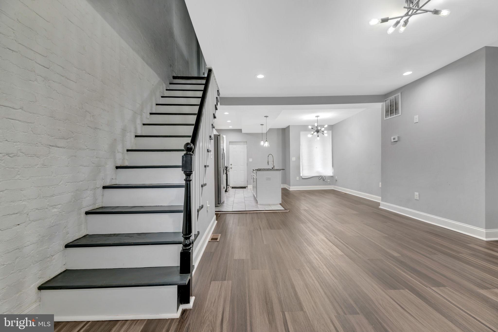 a view of entryway with wooden floor