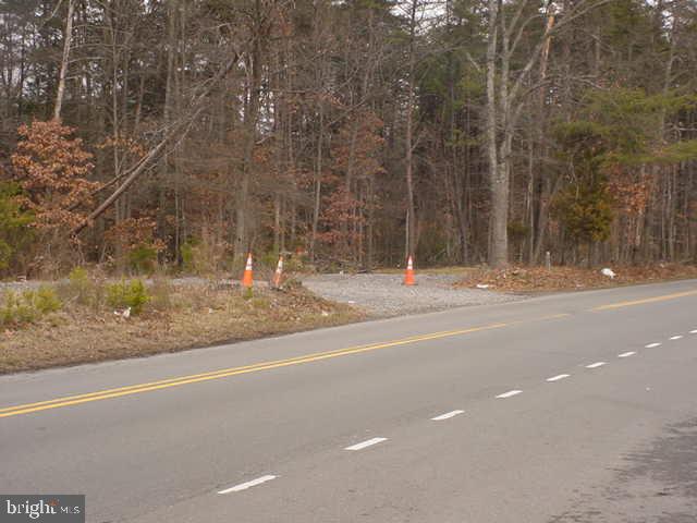 a view of a house with a road