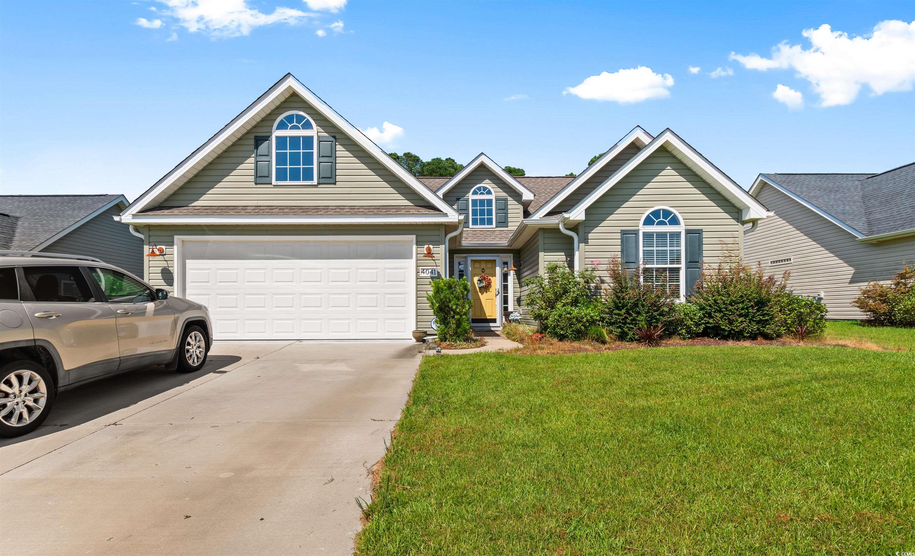 View of front of house featuring a front lawn