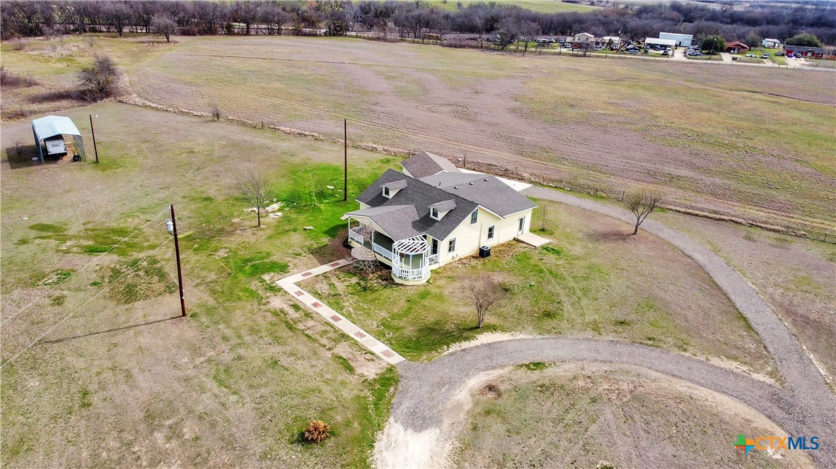 an aerial view of a house with a lake view