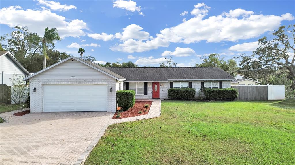 a front view of a house with yard