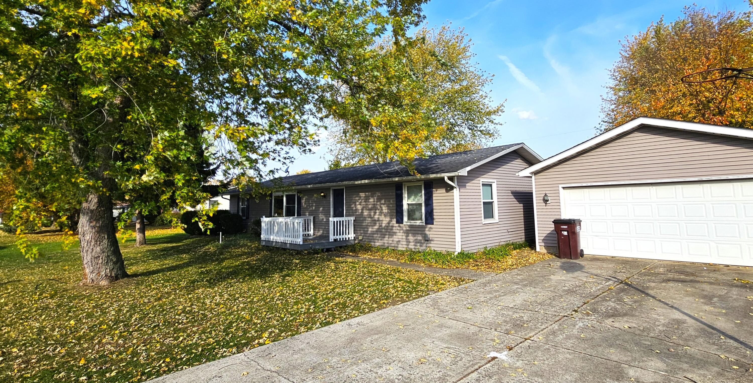 front view of a house with a yard