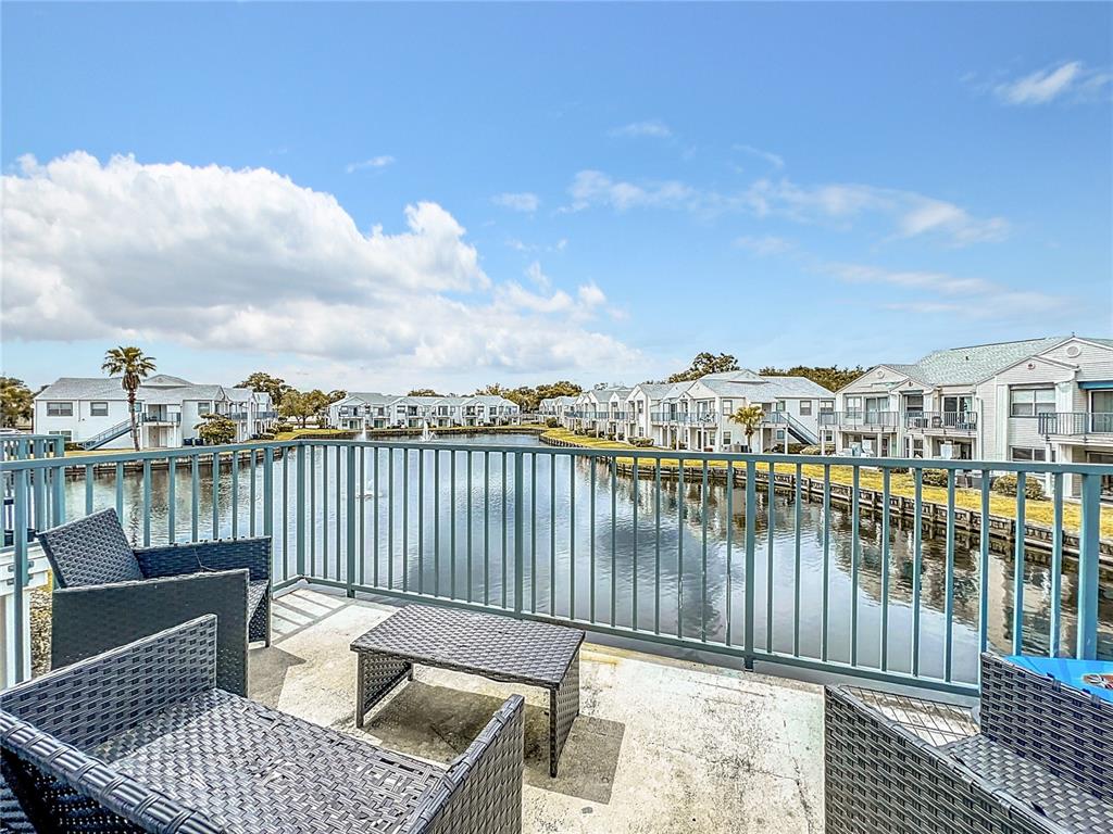 a balcony with a water view