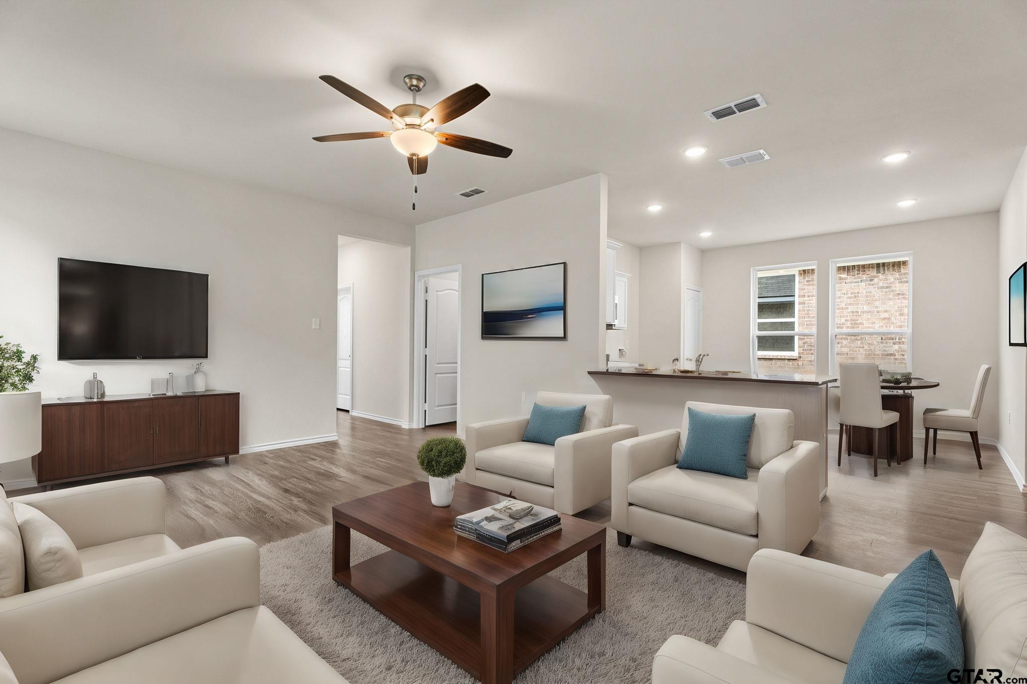 a living room with furniture and a flat screen tv