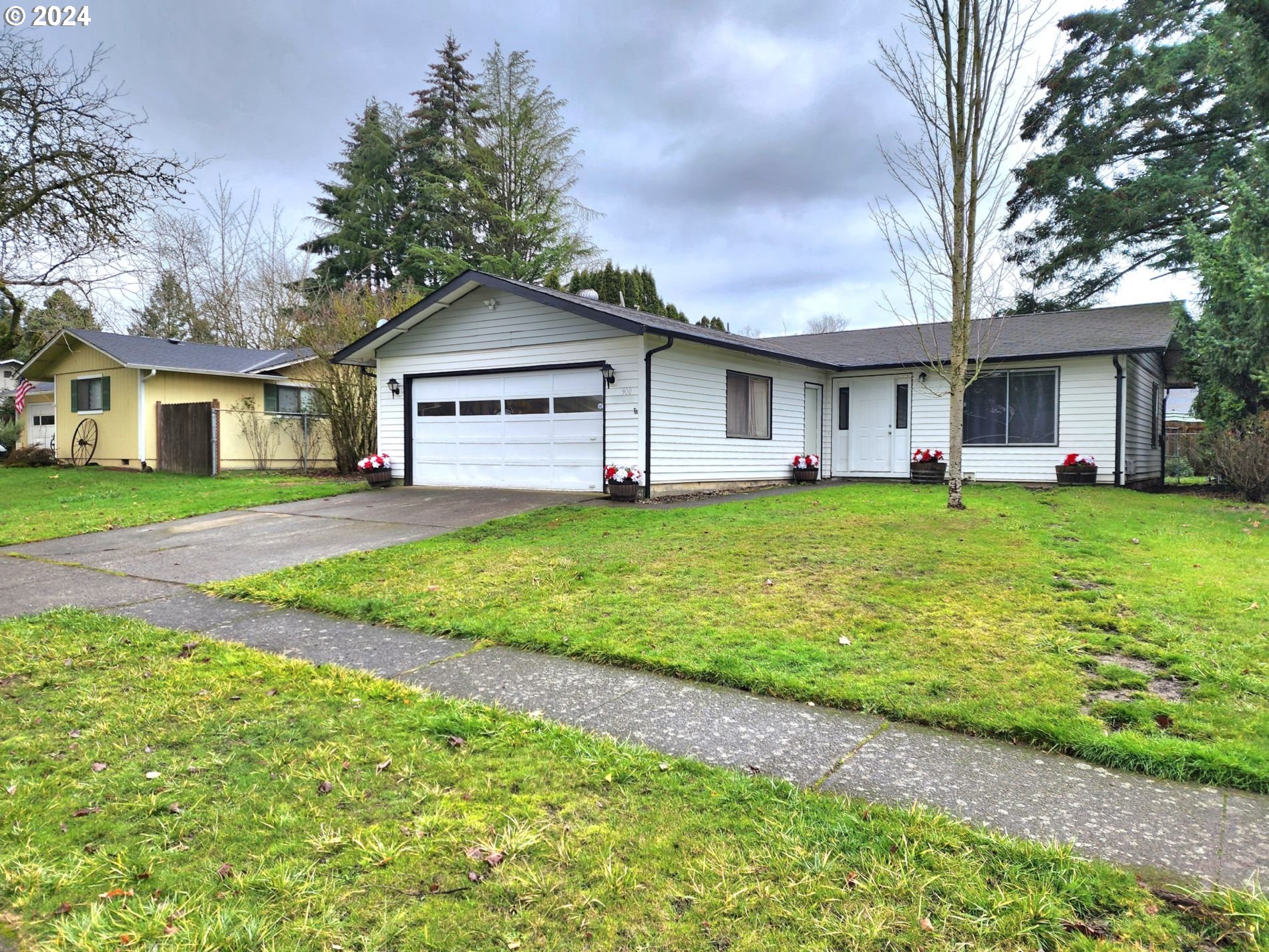 a big house with a big yard and large trees