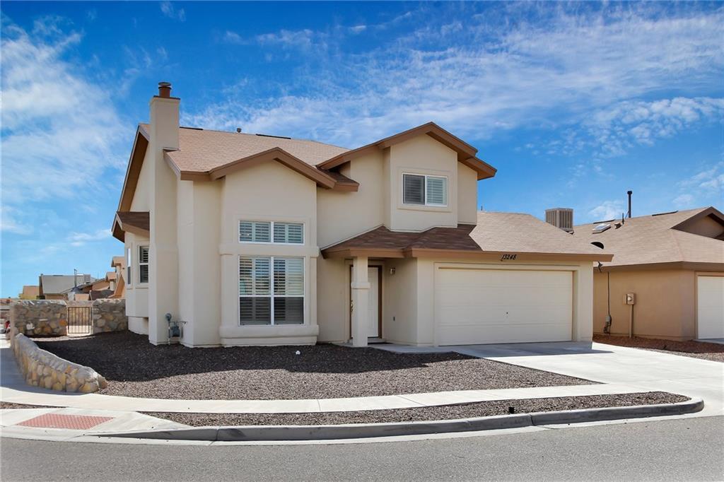 a front view of a house with a garage