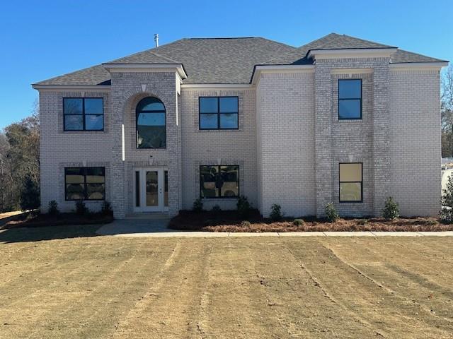 a front view of a house with a yard