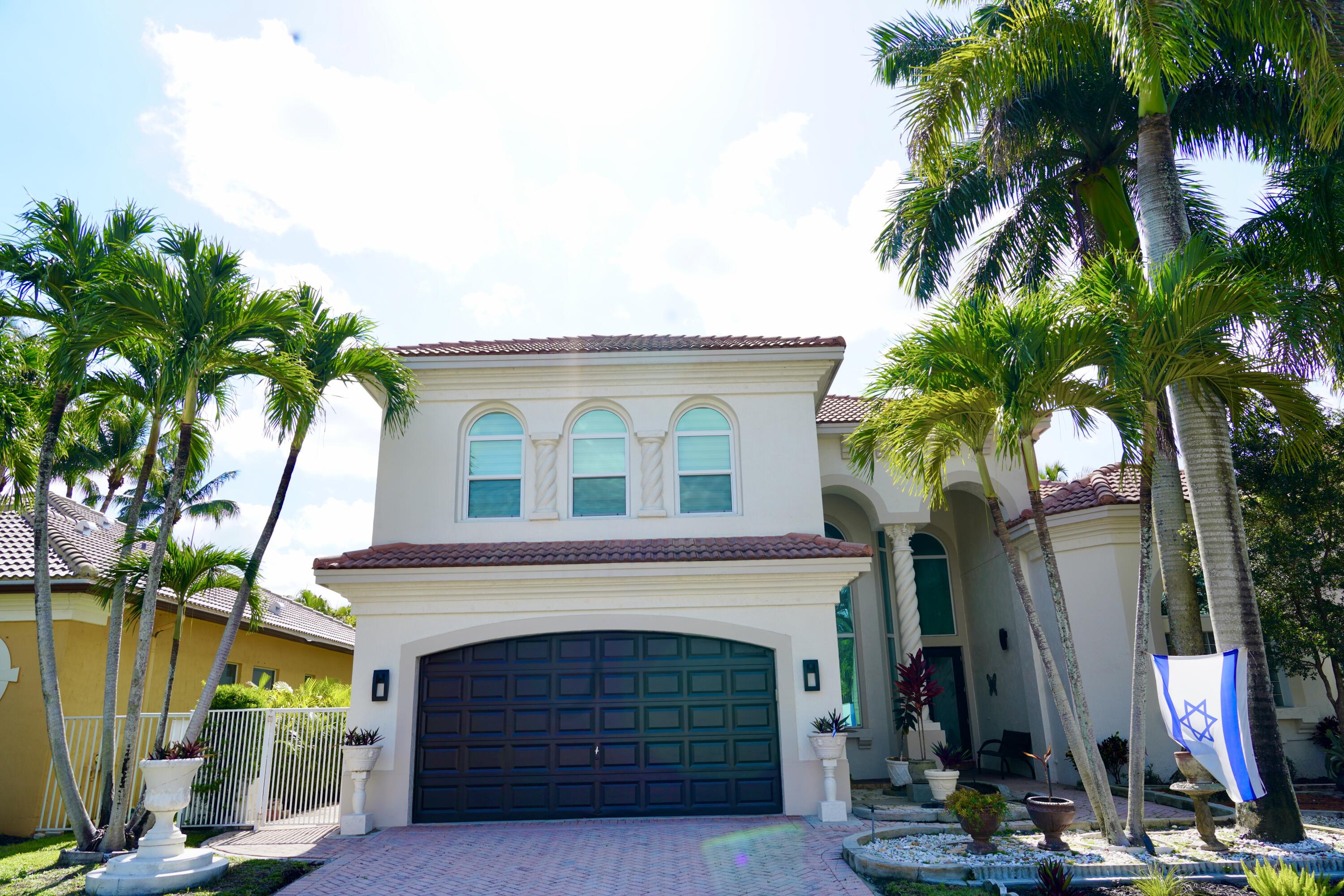 a front view of a house with yard