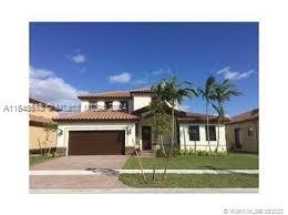 a view of a house with a yard and garage