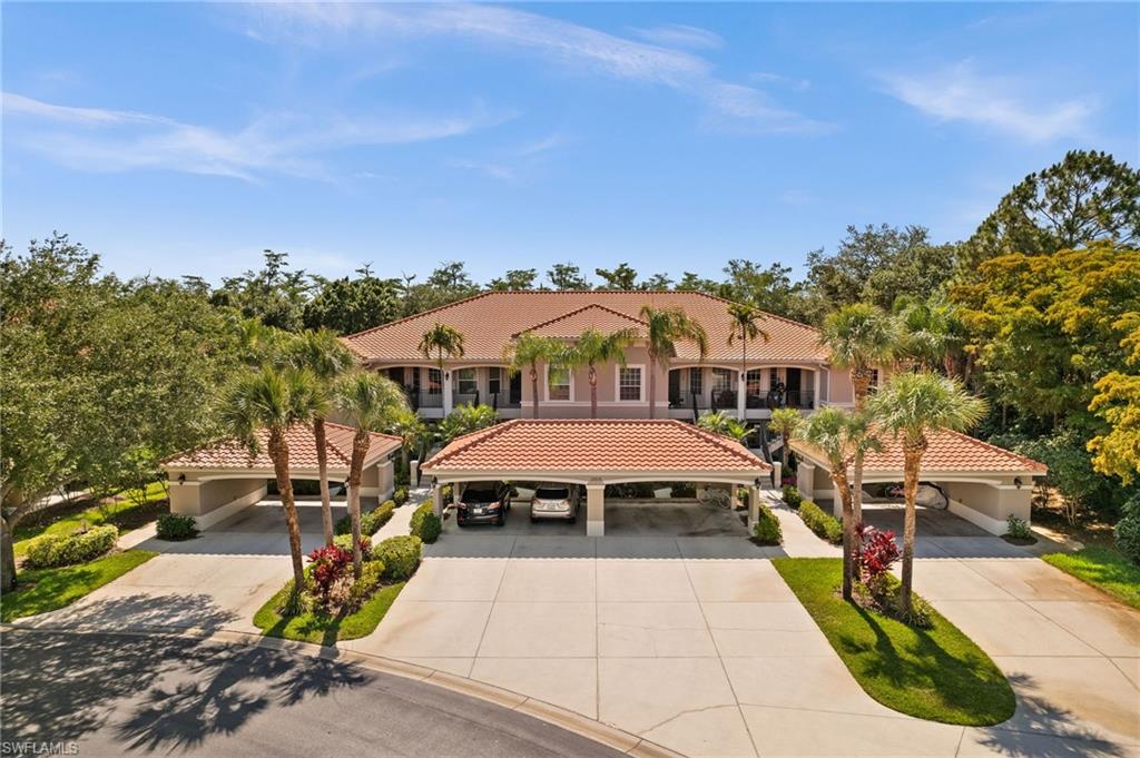 an aerial view of a house with swimming pool and furniture