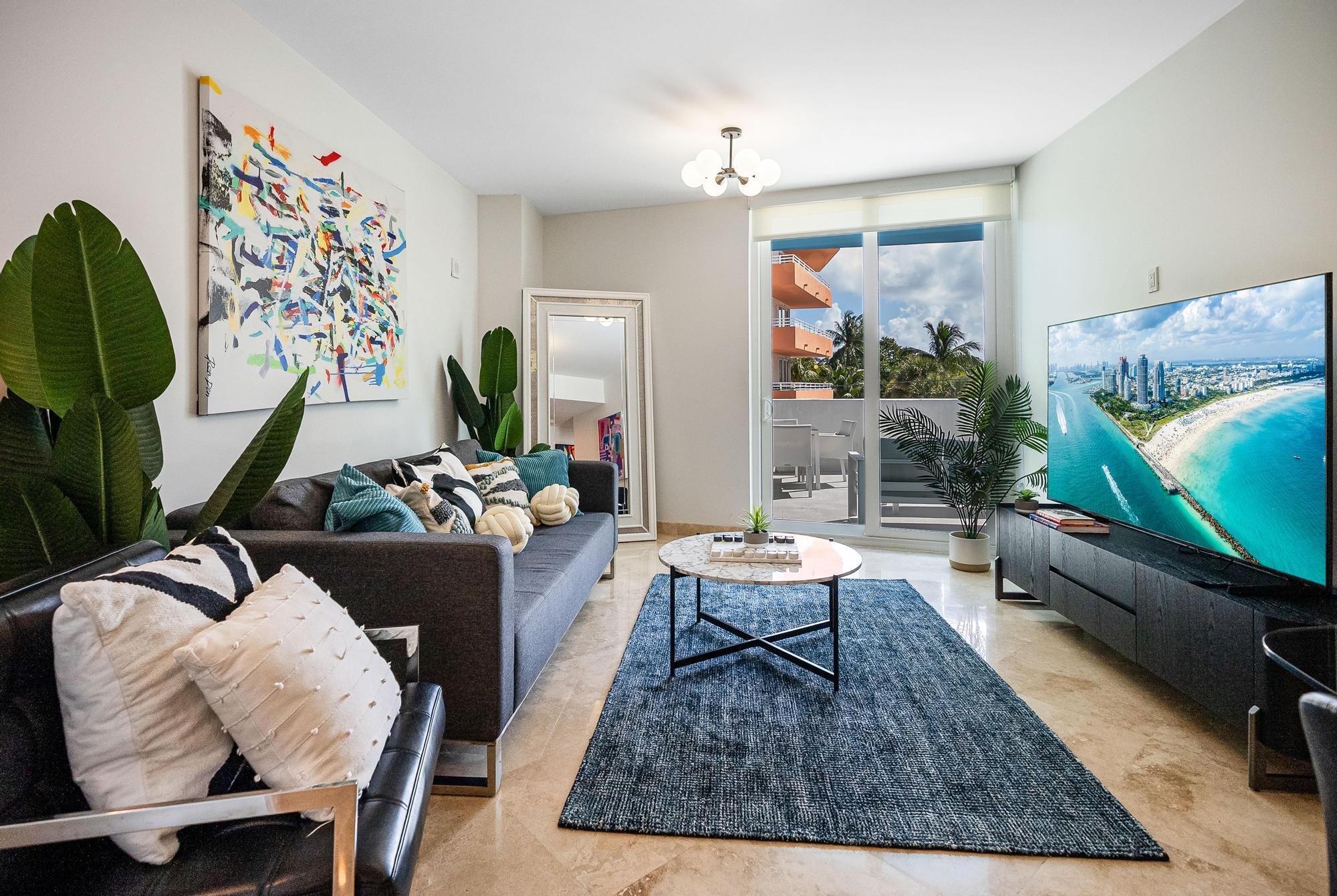 a living room with furniture rug and wooden floor