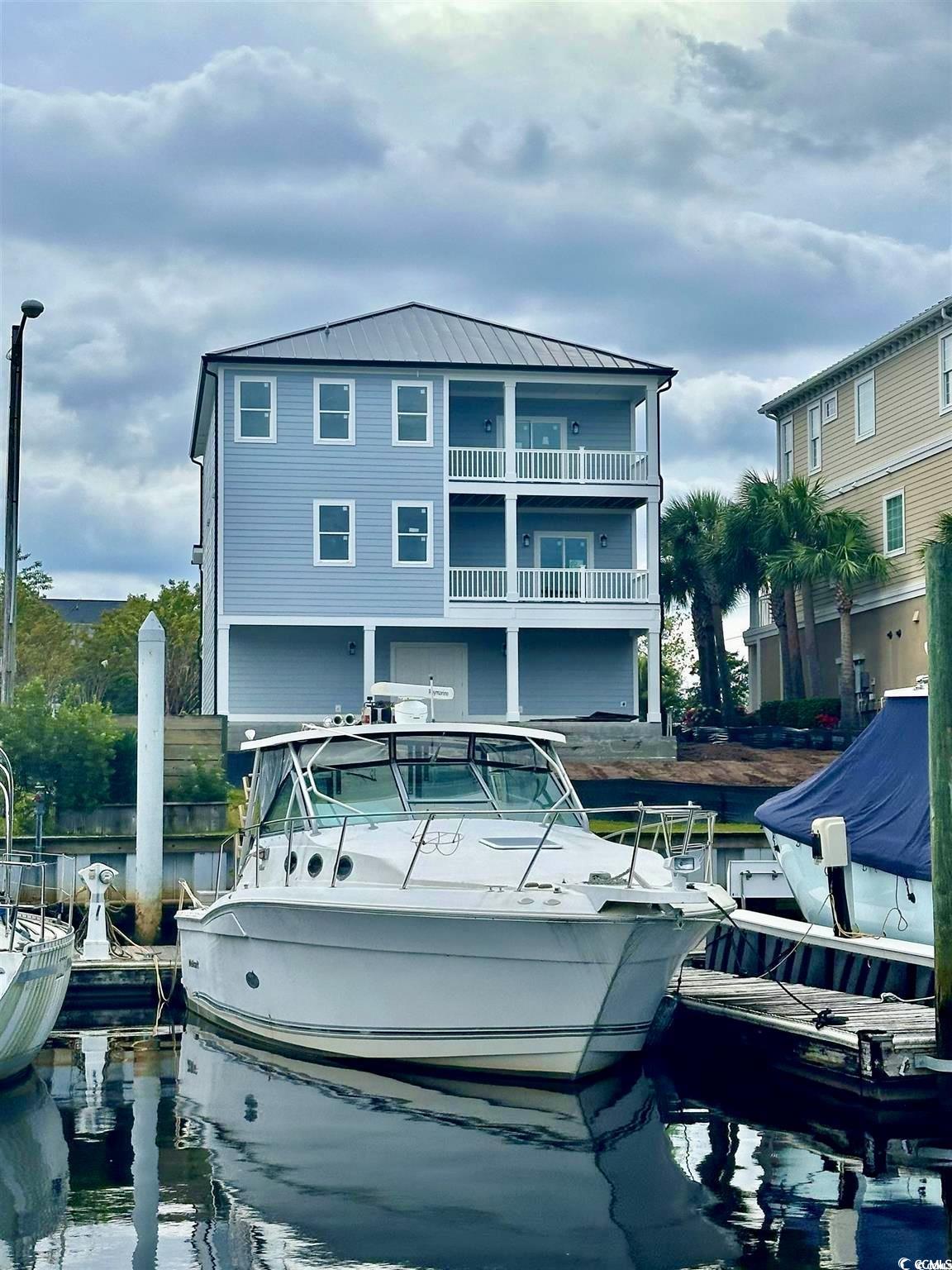 Rear view of house with a water view