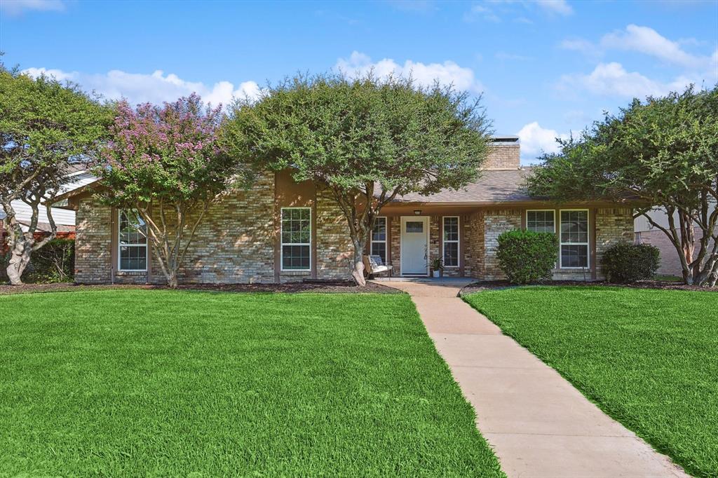 front view of a house with a yard