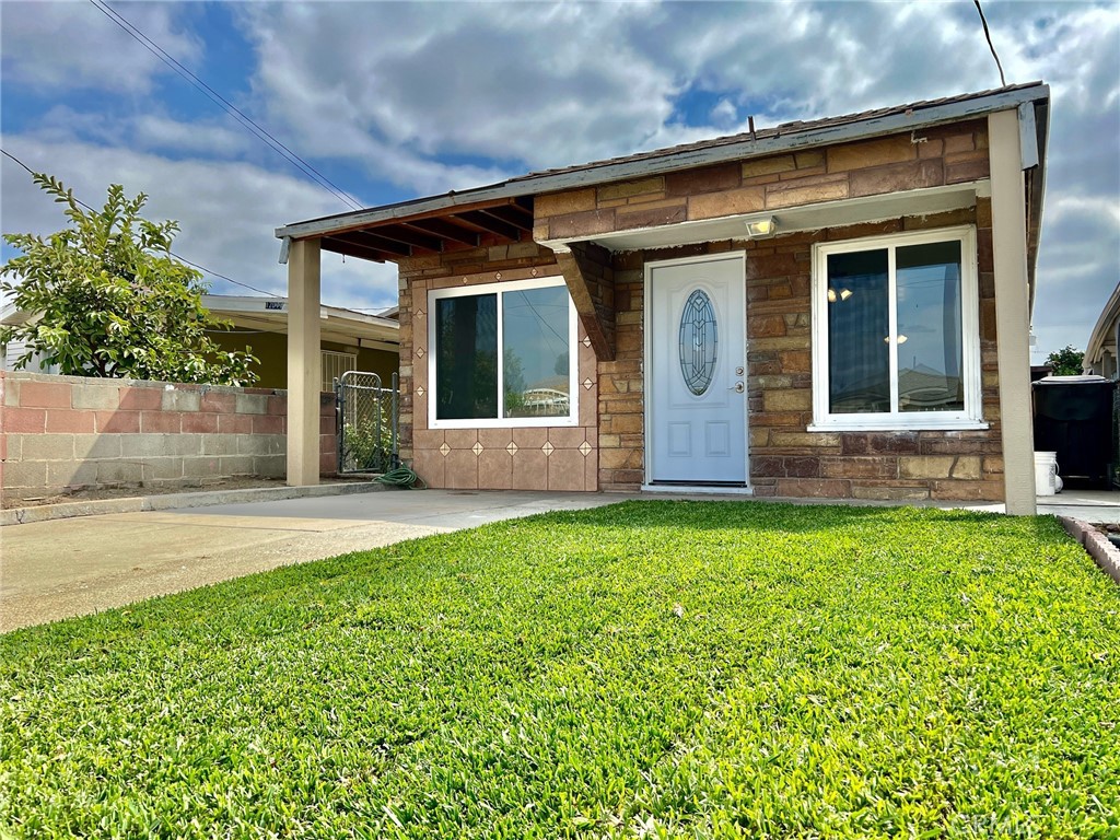 front view of a house with a yard