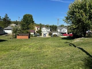 a view of outdoor space with deck and yard