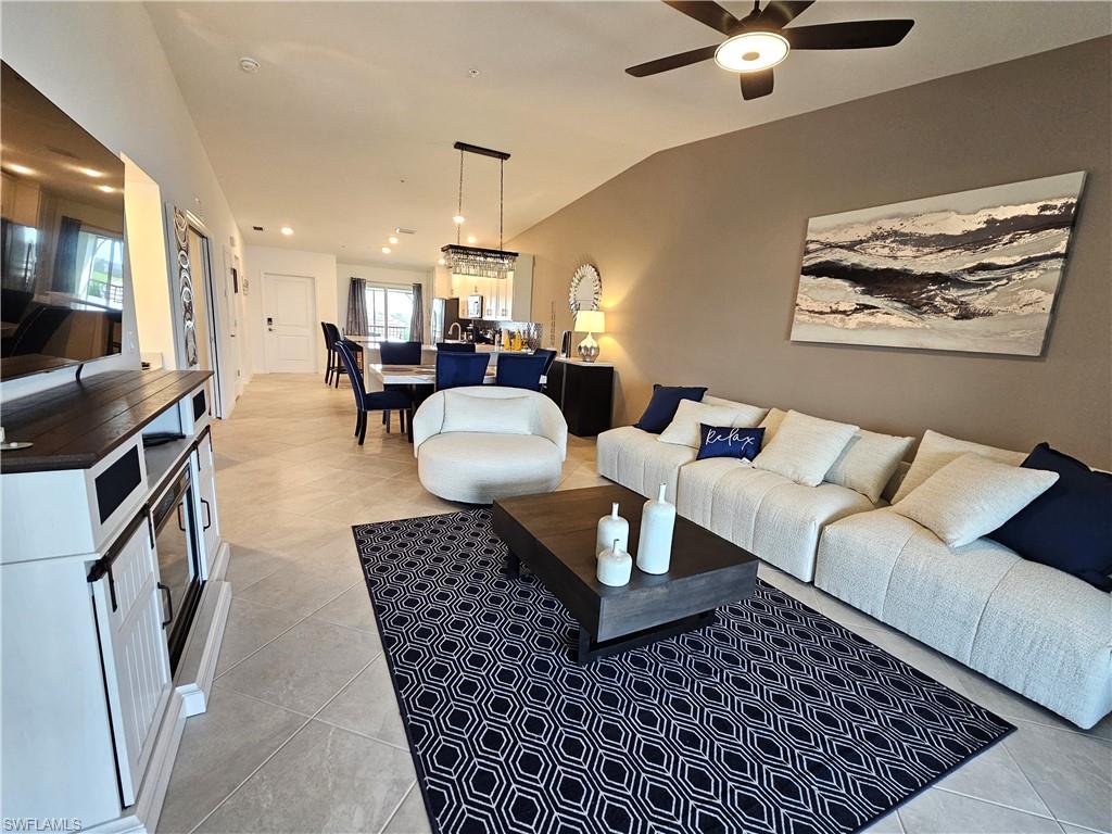 a living room with furniture and a rug