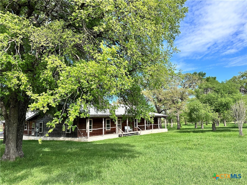 front view of a house with a garden