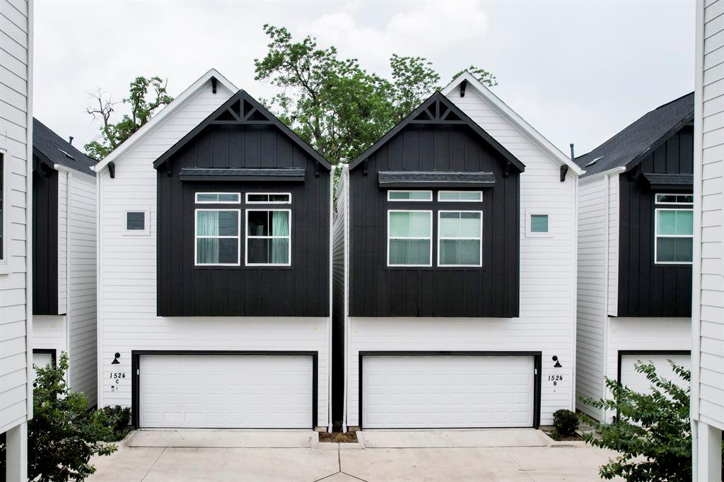 a front view of a house with garage