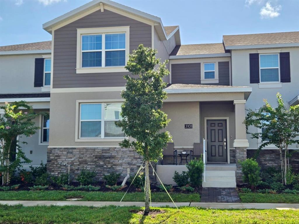 a view of house with yard in front of it