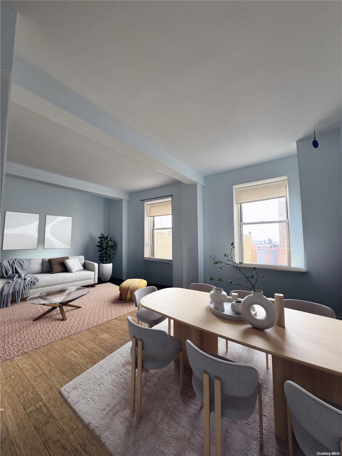 a living room with furniture kitchen view and a window