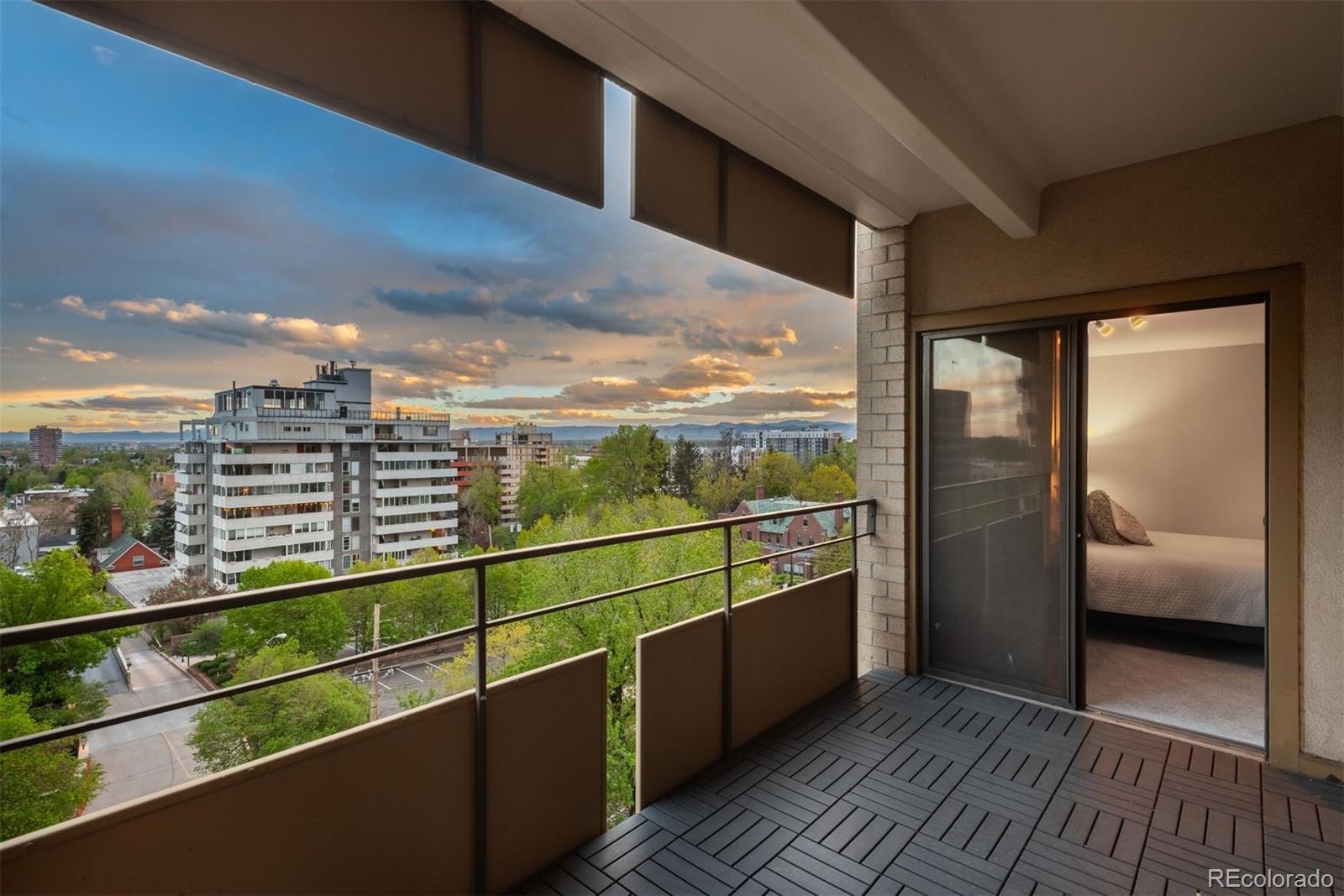 a view of a balcony with wooden floor