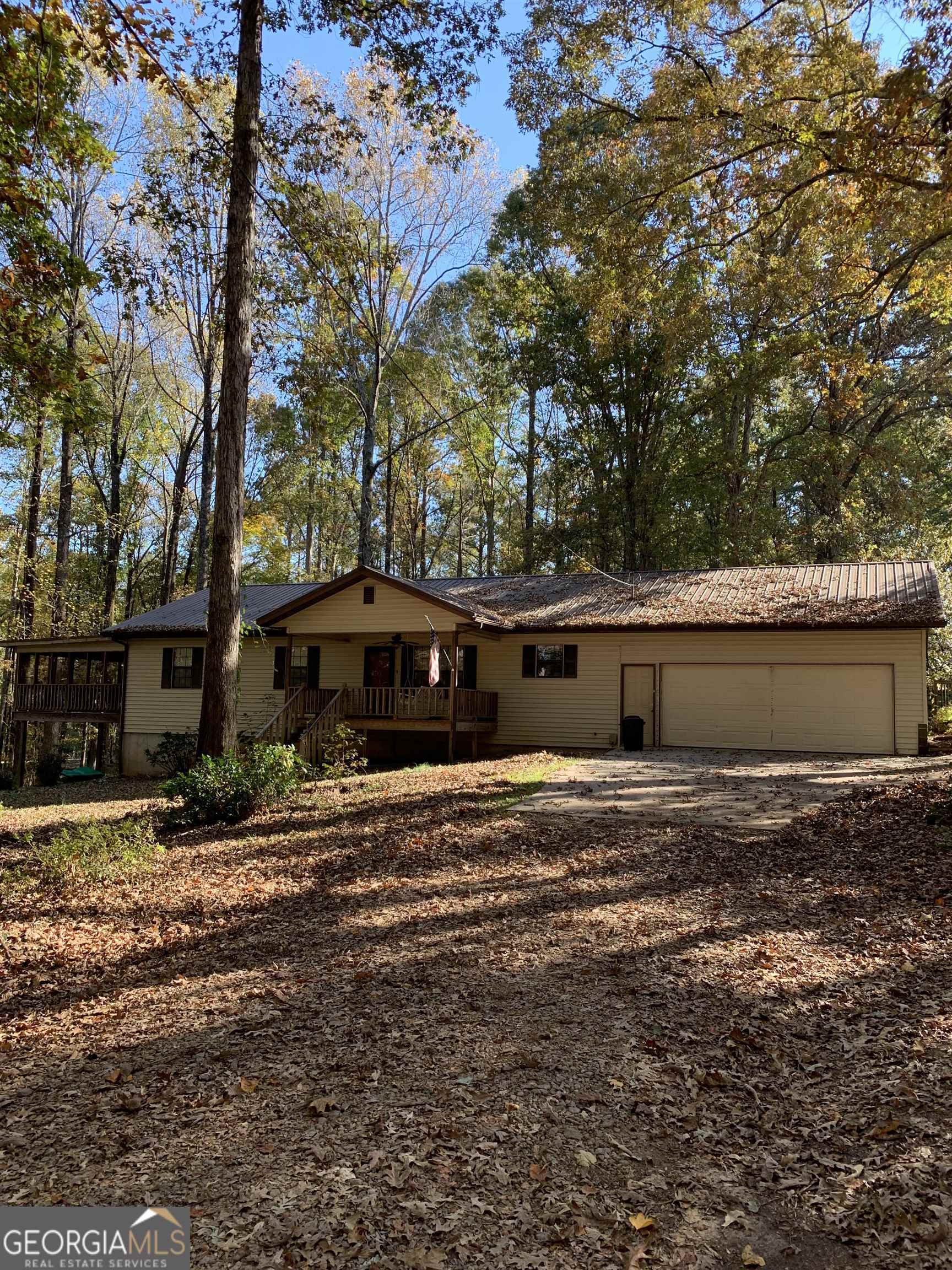 a big house with trees in front of it