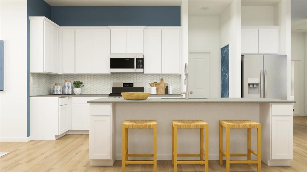 a kitchen with appliances cabinets and a sink