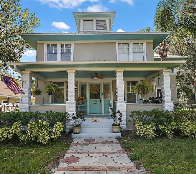 front view of a house with a yard