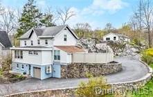 Rear view of property featuring a garage