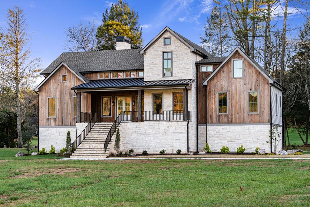 a view of front a house with a yard