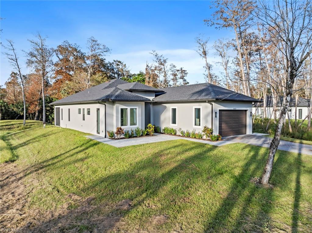 a front view of a house with a yard