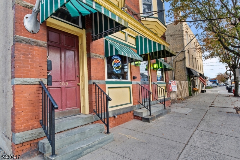 a view of a street with sitting area