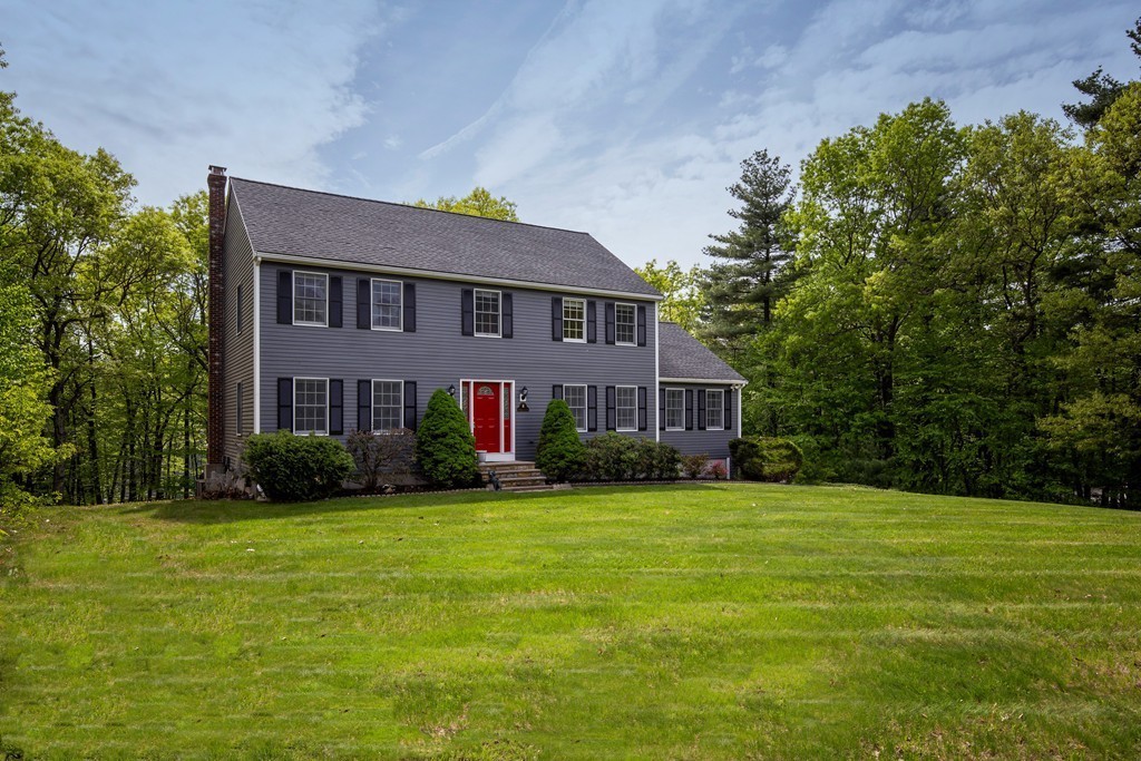 a view of a house with a big yard