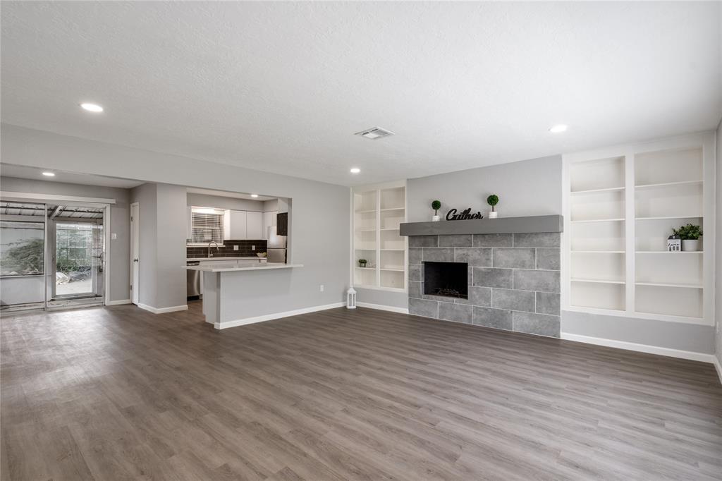 Welcome to 9332 Derrik Drive! A gorgeous unit with an open concept layout, built-in shelving and gorgeous vinyl plank floors.