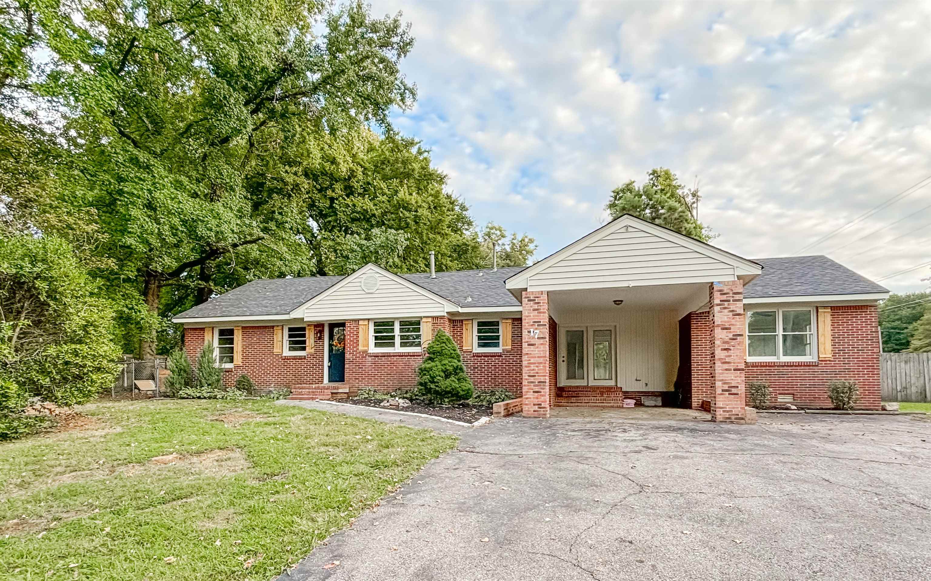 a front view of a house with yard