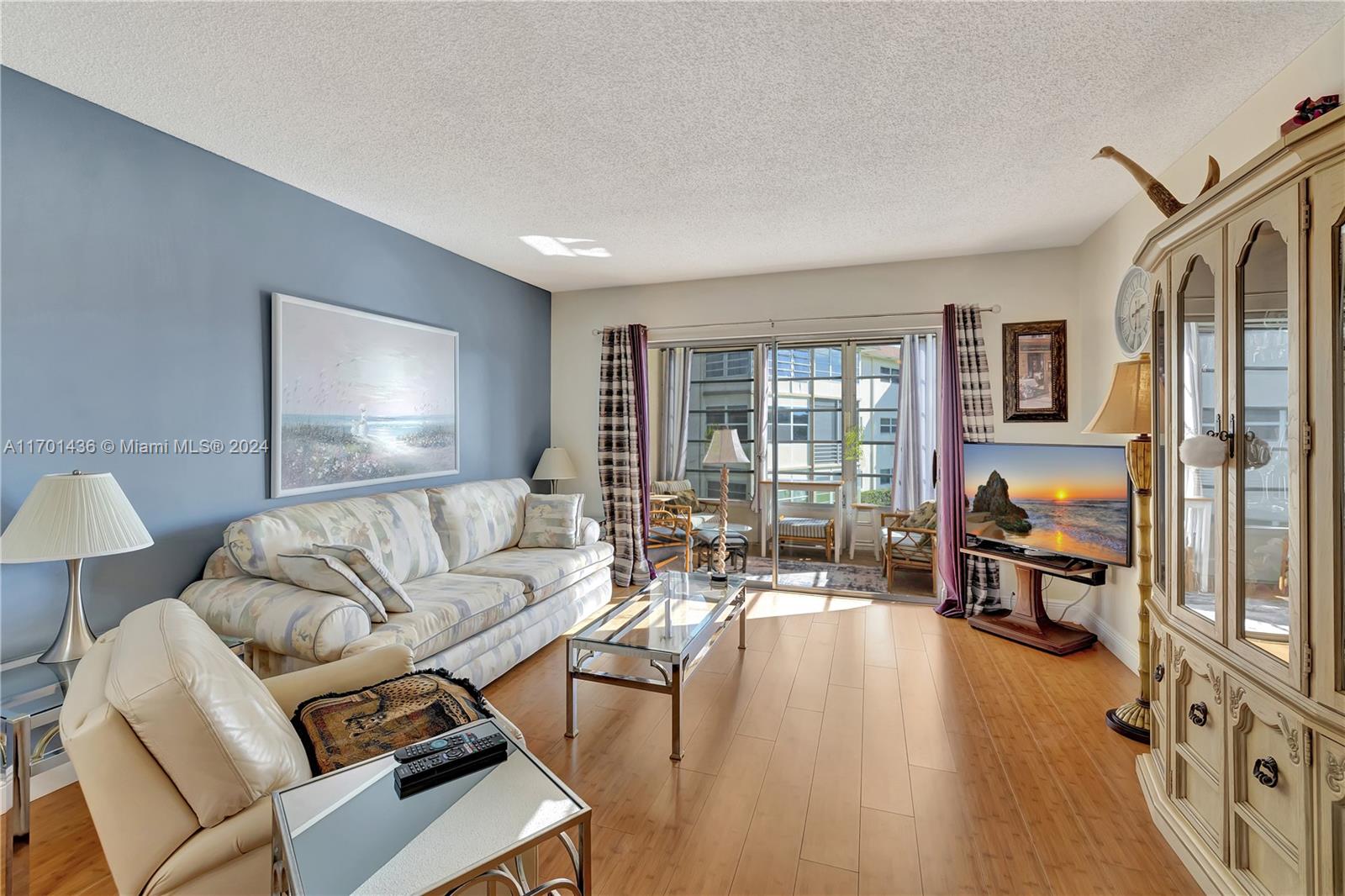 a living room with furniture fireplace and a flat screen tv