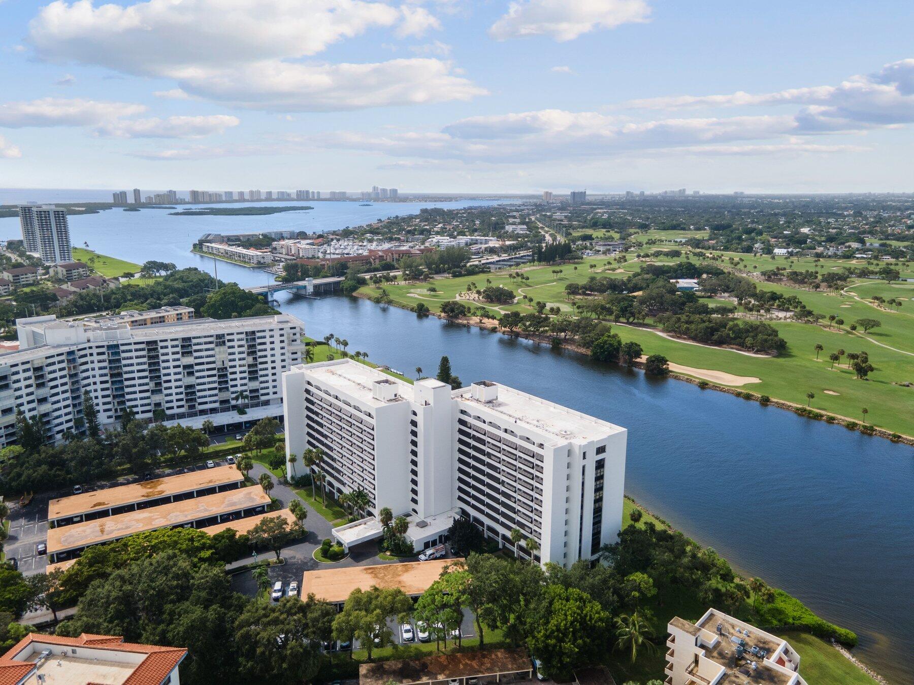 a view of a lake with tall buildings